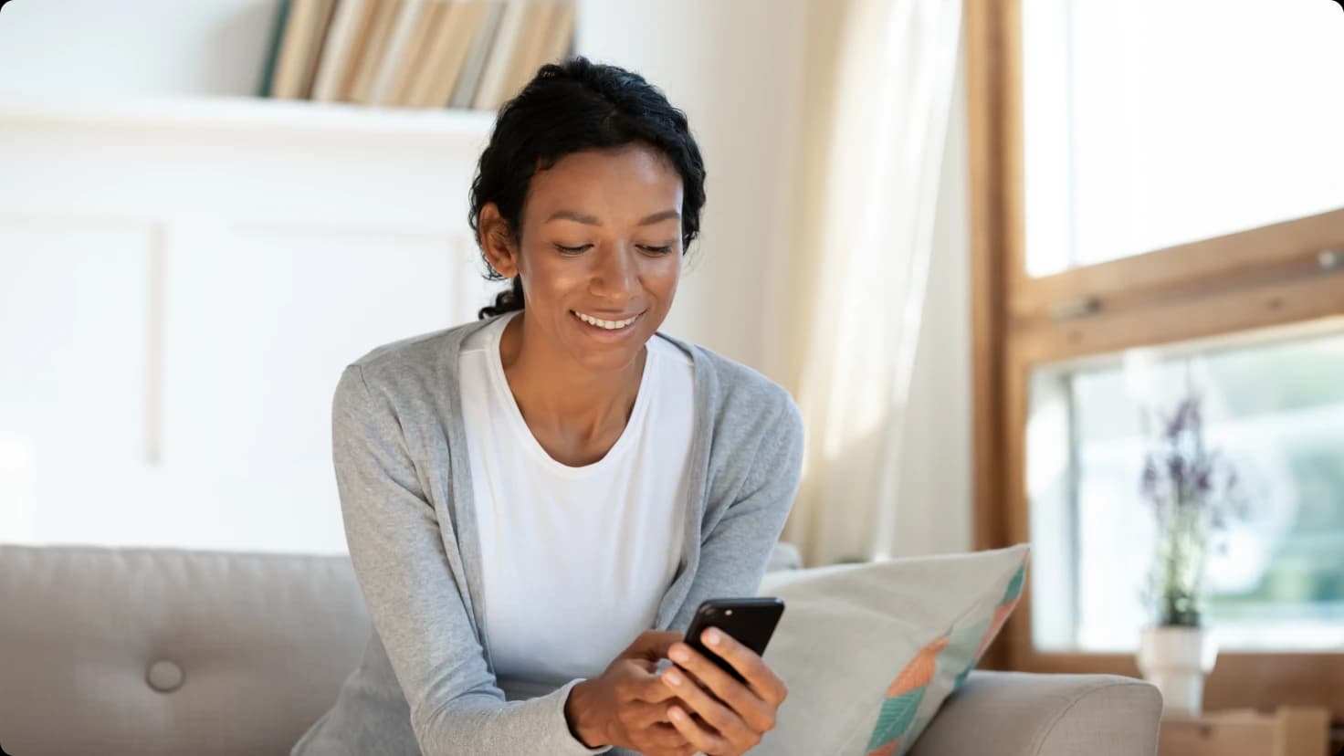 Woman scheduling garage door service on phone