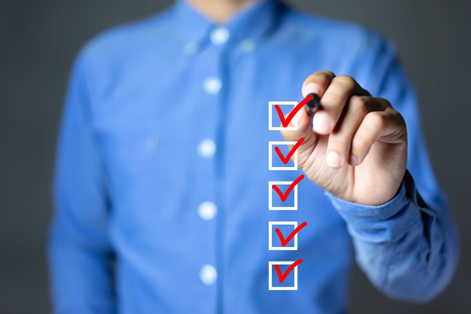 Businessman Marking A Checklist