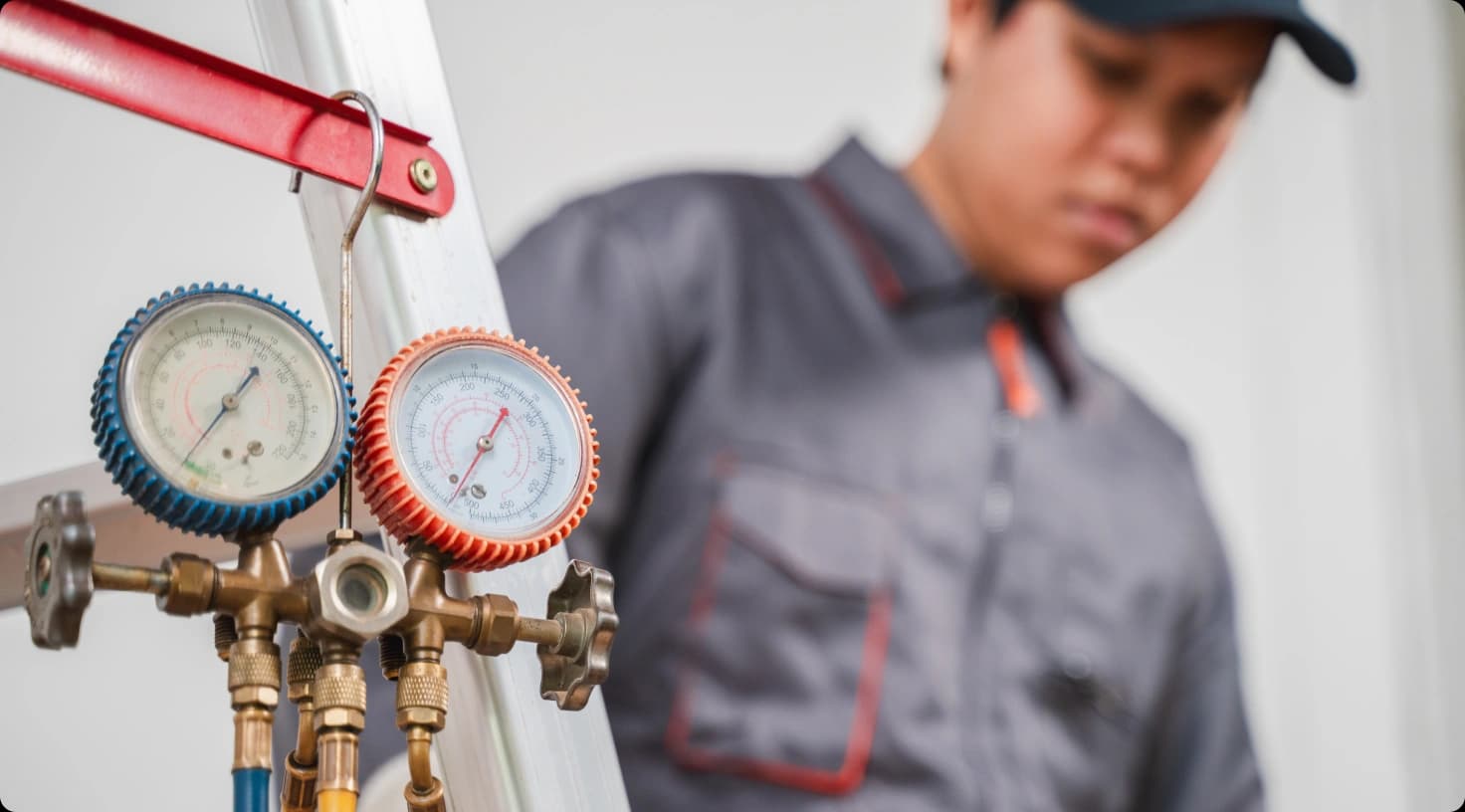 Hvac Technician Working Pressure Gauge