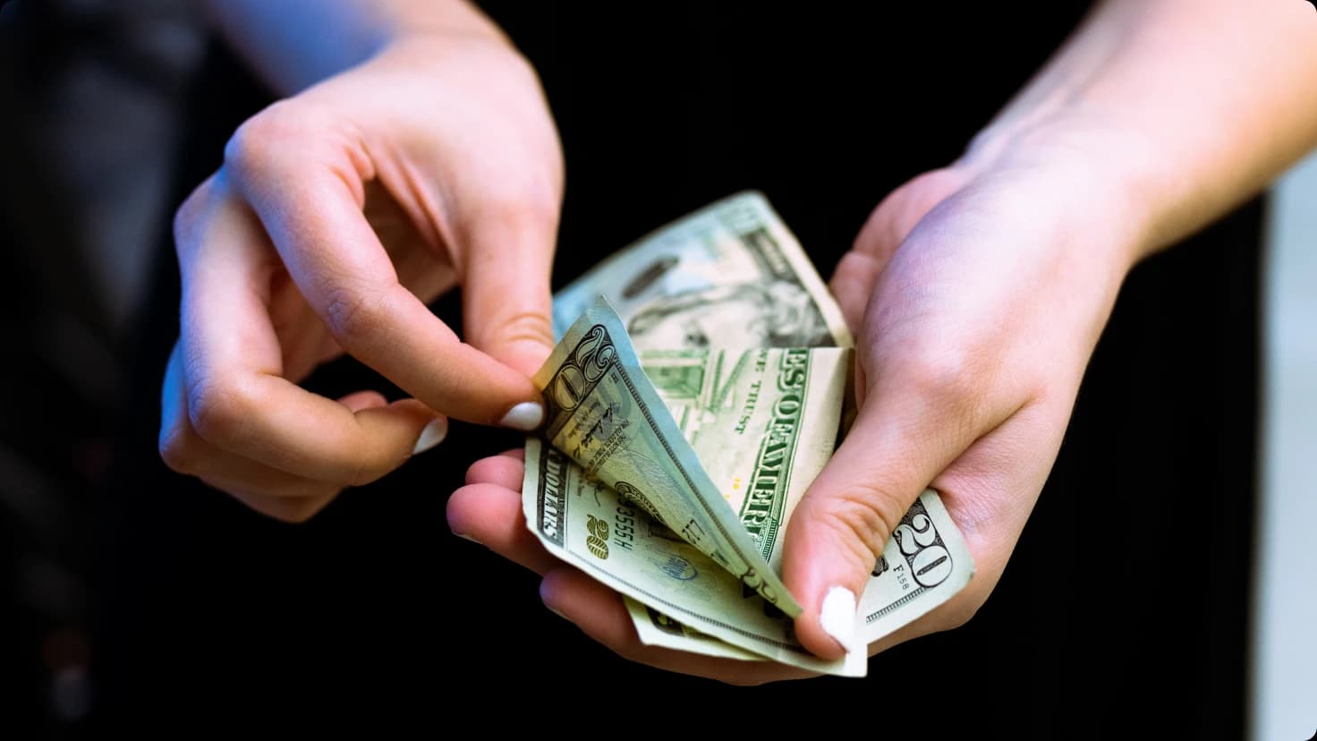Woman With Money In Hands