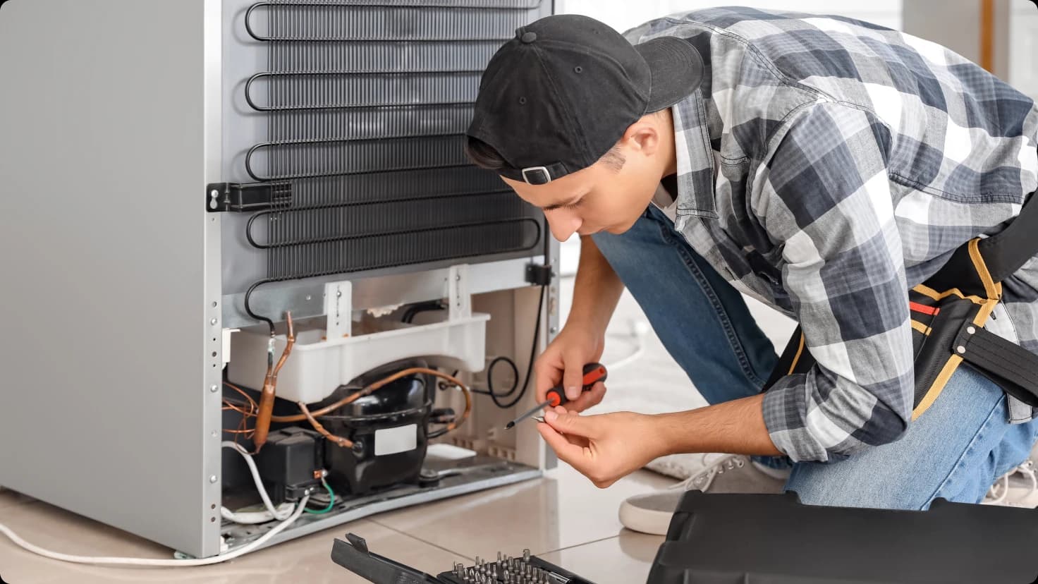 Appliance Repair Technician Is Working