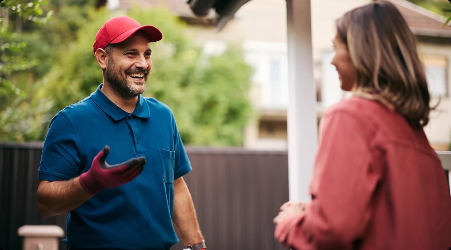 Professional Plumber Consulting With Customer