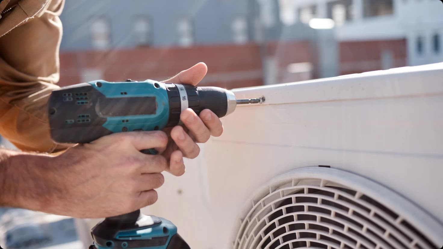 Hvac Technician Repairs A C Unit