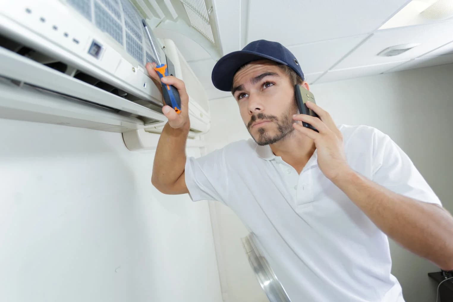 Hvac Technician Checking Remote Works