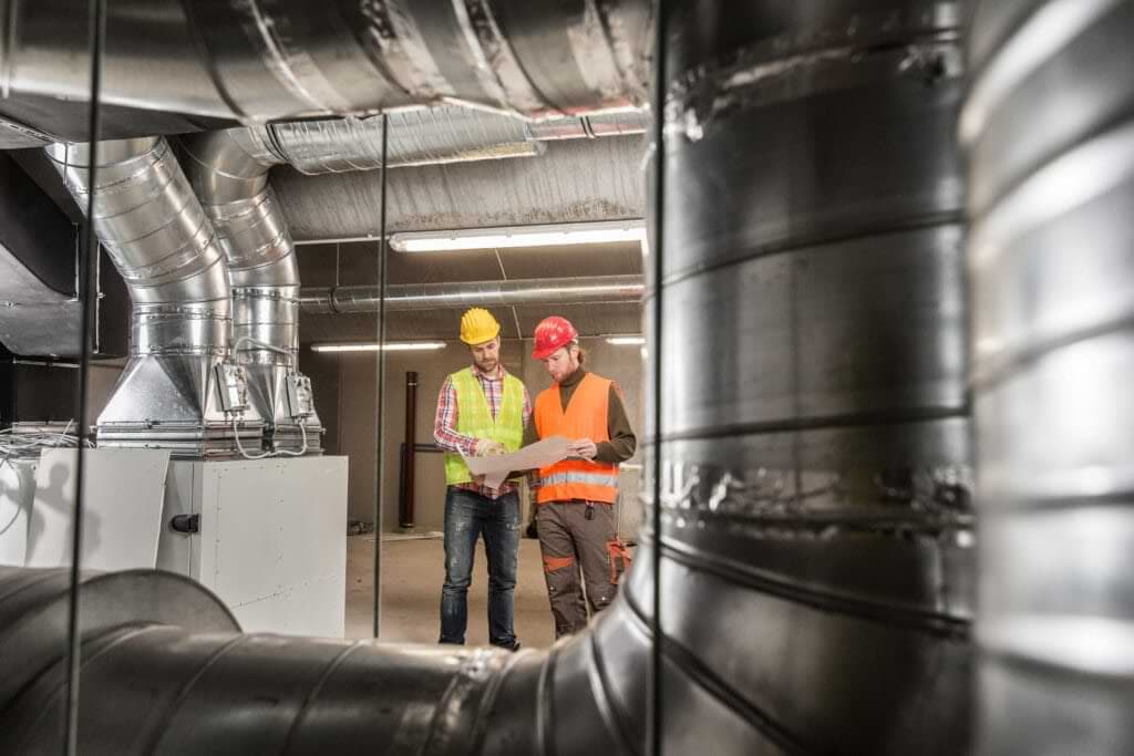 Hvac Technicians Inspecting Pipes